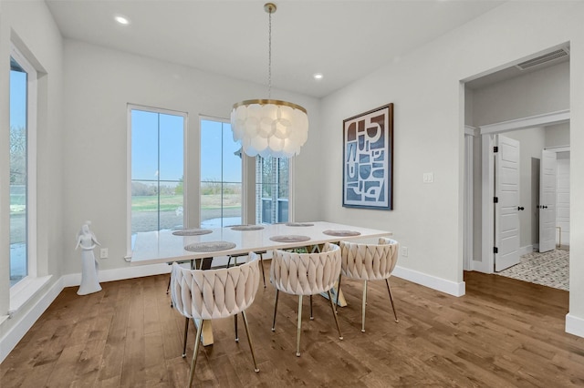 dining space featuring hardwood / wood-style floors