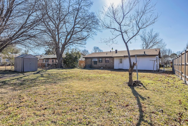 view of yard with a storage unit