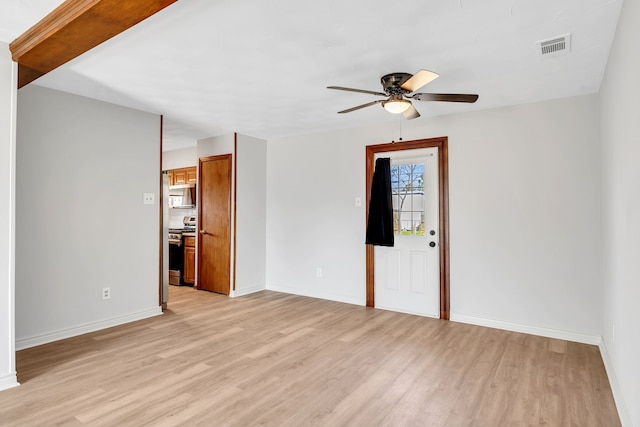 spare room featuring ceiling fan and light hardwood / wood-style flooring