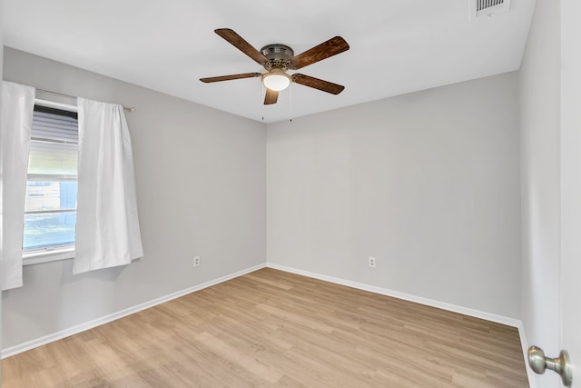 spare room with light hardwood / wood-style floors and ceiling fan