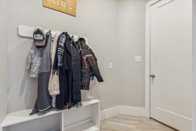 mudroom with light hardwood / wood-style floors