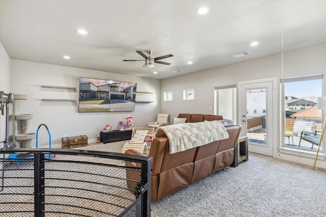 carpeted bedroom featuring ceiling fan and access to exterior