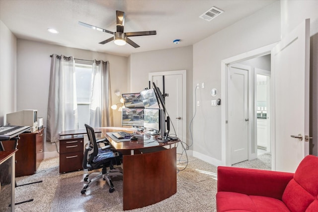 office with ceiling fan and light colored carpet