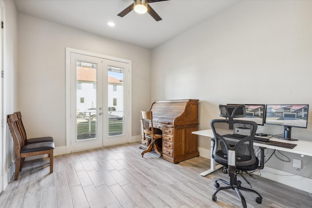 home office with french doors, ceiling fan, and light wood-type flooring