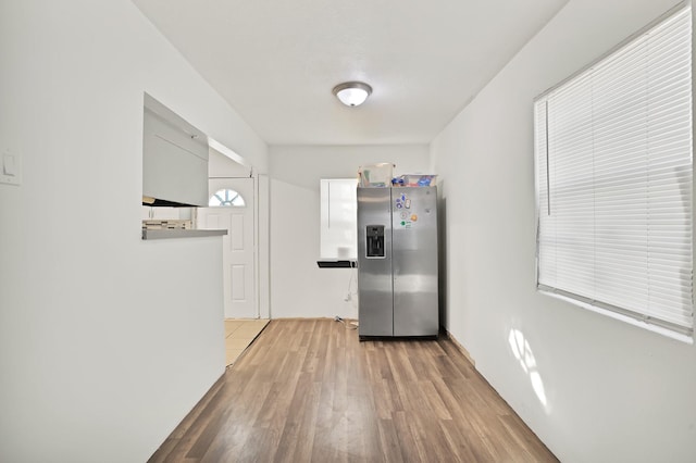 kitchen featuring light hardwood / wood-style floors and stainless steel fridge