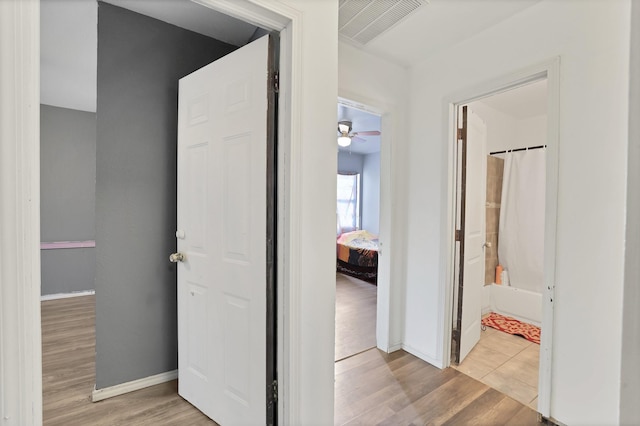 hallway featuring light wood-type flooring