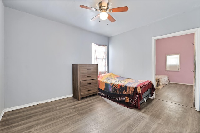 bedroom featuring hardwood / wood-style flooring and ceiling fan