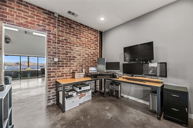 office space featuring brick wall