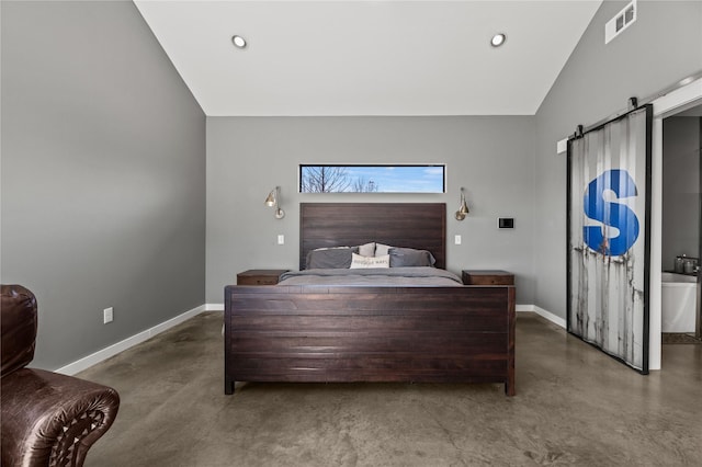 bedroom with vaulted ceiling and a barn door