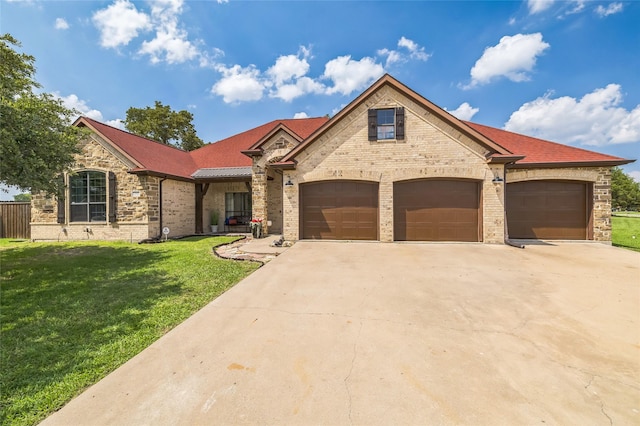 10545 Lago Vis, Quinlan, TX 75474 - view of front facade featuring driveway, a front lawn, a garage, and brick siding