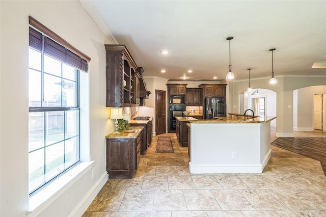10545 Lago Vis, Quinlan, TX 75474 - kitchen featuring arched walkways, appliances with stainless steel finishes, crown molding, dark brown cabinets, and baseboards