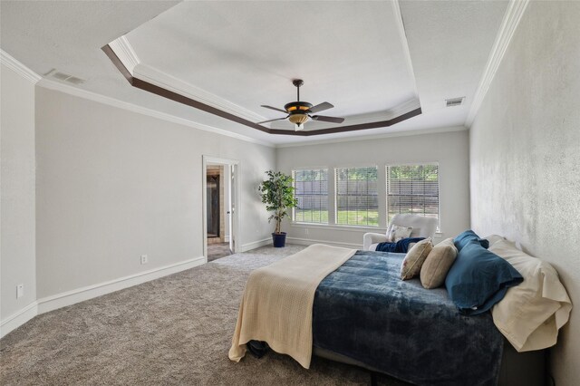 10545 Lago Vis, Quinlan, TX 75474 - carpeted bedroom featuring a tray ceiling, crown molding, baseboards, and ceiling fan