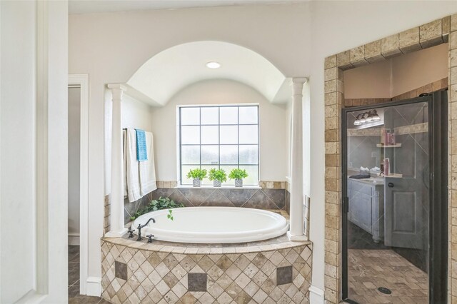 10545 Lago Vis, Quinlan, TX 75474 - full bathroom with decorative columns, a bath, a shower stall, and tile patterned floors
