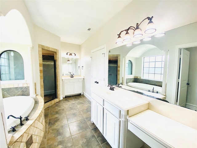 bathroom featuring vanity and shower with separate bathtub