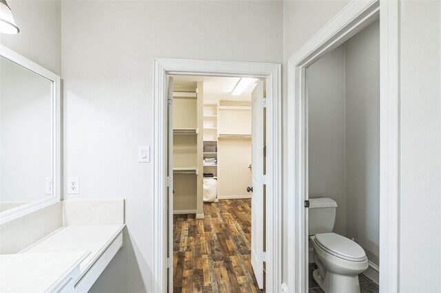 10545 Lago Vis, Quinlan, TX 75474 - bathroom featuring wood finished floors, toilet, and vanity