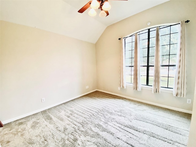 unfurnished room featuring lofted ceiling and ceiling fan