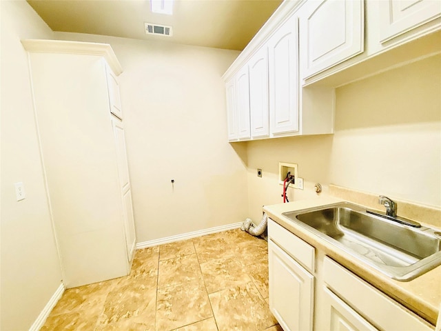 washroom featuring cabinets, electric dryer hookup, sink, and washer hookup