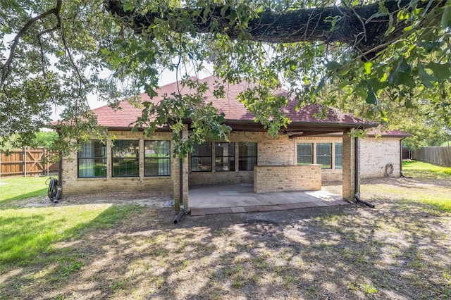 10545 Lago Vis, Quinlan, TX 75474 - back of house with a patio area, brick siding, and roof with shingles