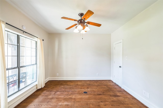10545 Lago Vis, Quinlan, TX 75474 - empty room with plenty of natural light, wood finished floors, a ceiling fan, and baseboards