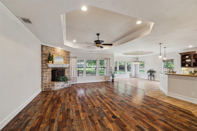 10545 Lago Vis, Quinlan, TX 75474 - unfurnished living room featuring hardwood / wood-style flooring, ornamental molding, a fireplace, recessed lighting, and a ceiling fan