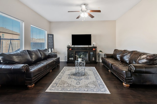 living room with dark hardwood / wood-style floors and ceiling fan