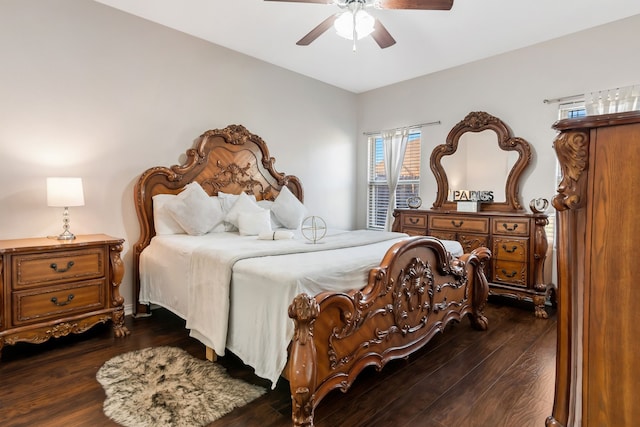 bedroom with ceiling fan and dark hardwood / wood-style floors