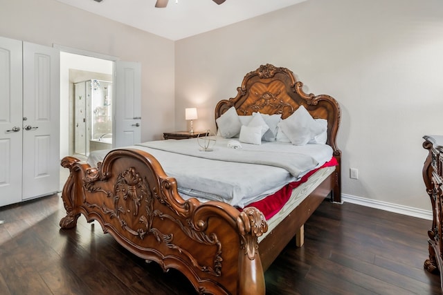 bedroom featuring ceiling fan, connected bathroom, dark hardwood / wood-style floors, and a closet