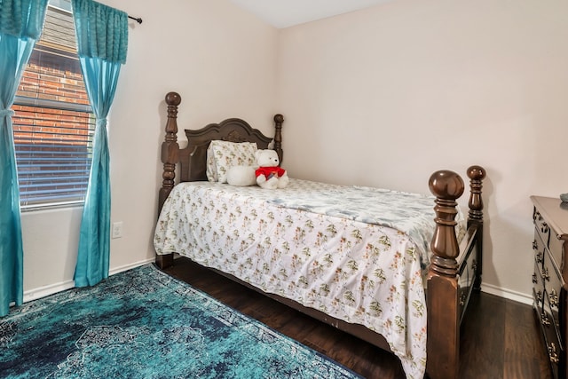 bedroom featuring dark wood-type flooring