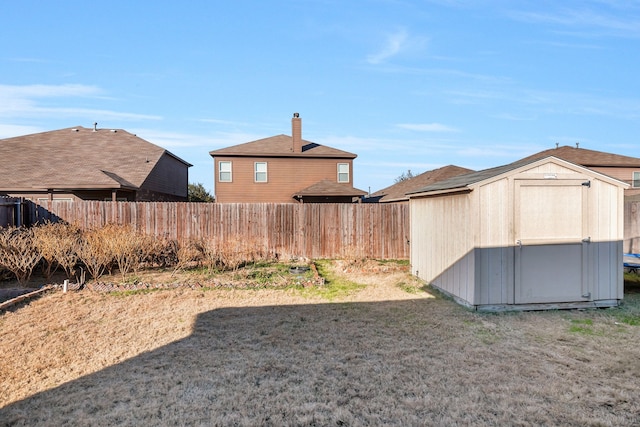 view of yard with a storage unit