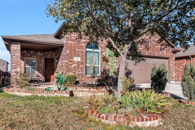 view of front of home with a garage and a front lawn