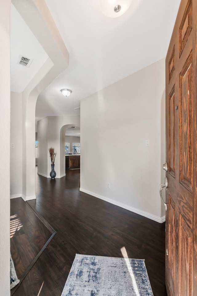 entrance foyer featuring dark hardwood / wood-style floors