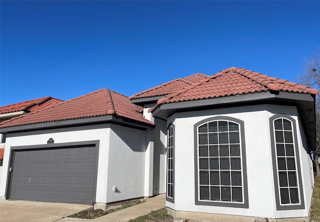 view of side of property featuring a garage