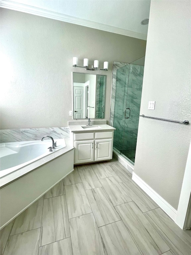 bathroom with vanity, independent shower and bath, and crown molding