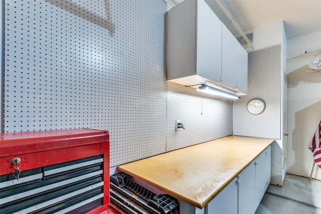 kitchen featuring wall chimney exhaust hood