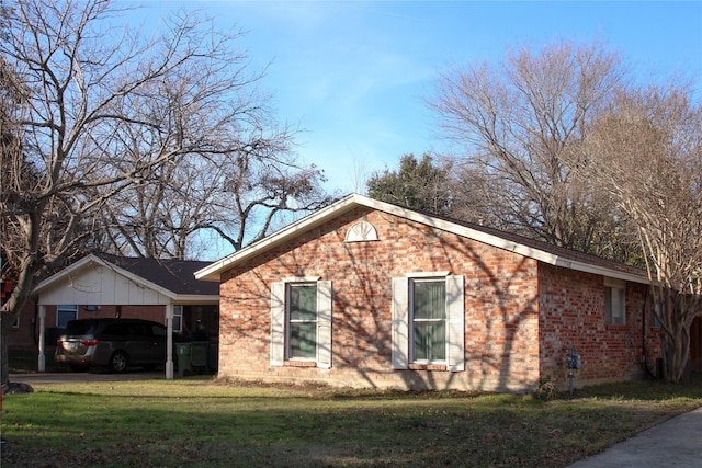 view of property exterior with a lawn and a carport