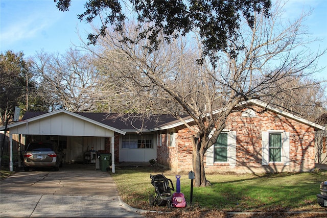 single story home featuring a front yard and a carport