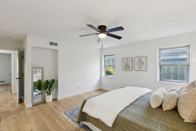 bedroom featuring ceiling fan and light hardwood / wood-style floors