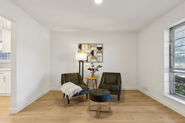 sitting room featuring light hardwood / wood-style floors