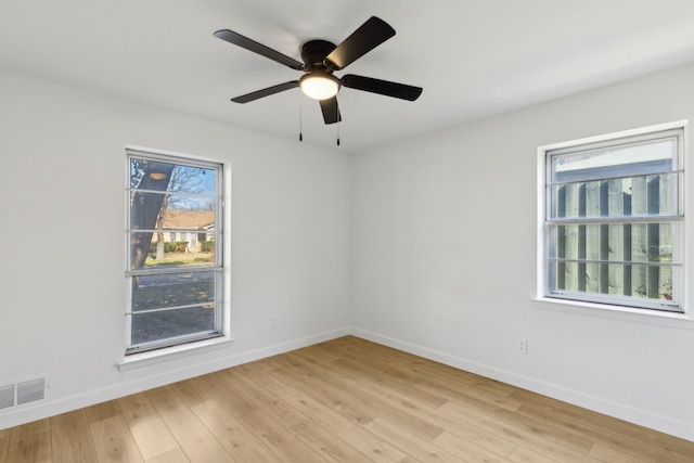 unfurnished room featuring light wood-type flooring and ceiling fan