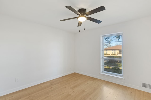 unfurnished room featuring light hardwood / wood-style floors, ceiling fan, and a healthy amount of sunlight