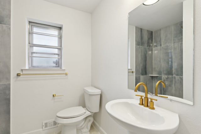 bathroom featuring sink and toilet