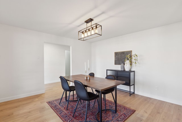 dining area with light hardwood / wood-style floors