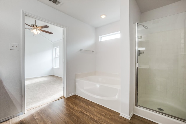 bathroom featuring wood-type flooring, plenty of natural light, separate shower and tub, and ceiling fan