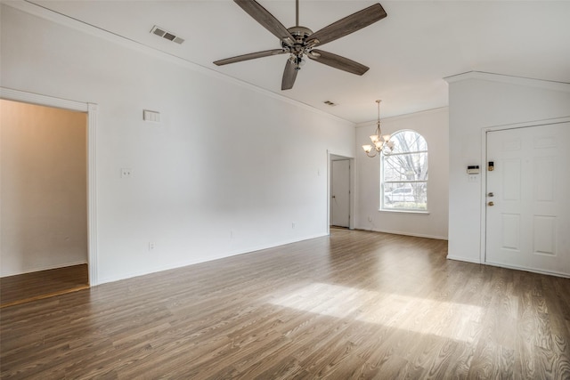 interior space featuring ceiling fan with notable chandelier, dark wood-type flooring, and crown molding