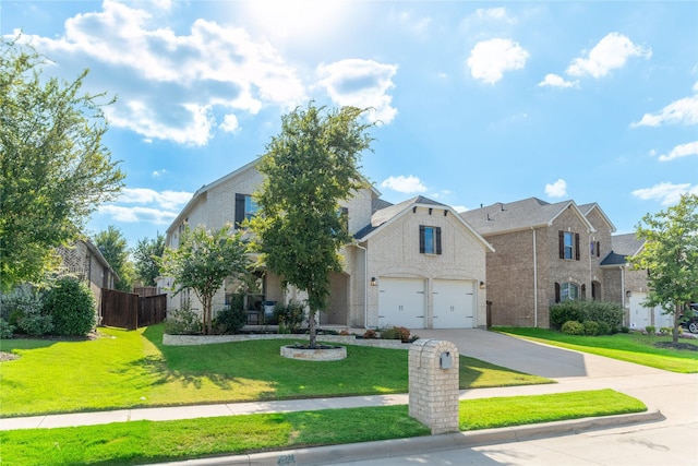 view of front of house with a garage, brick siding, fence, concrete driveway, and a front yard