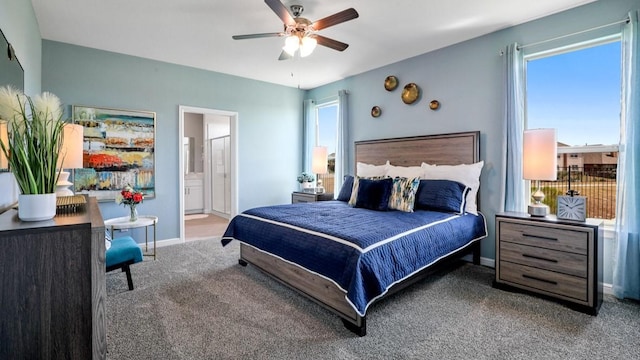 bedroom with carpet floors, connected bathroom, and ceiling fan