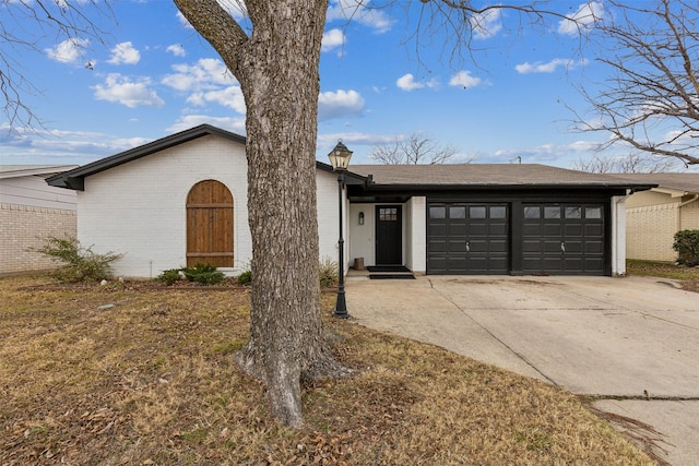 single story home featuring a garage