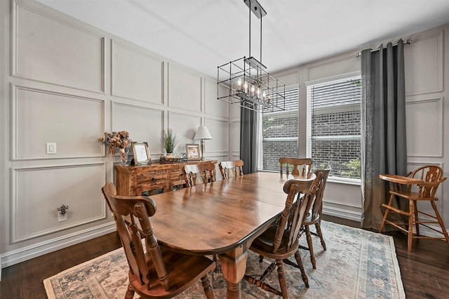 dining space featuring a notable chandelier and dark hardwood / wood-style flooring