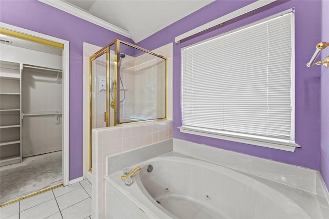 bathroom with tile patterned floors, independent shower and bath, and a textured ceiling