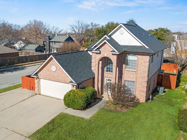 front facade featuring a garage and a front yard